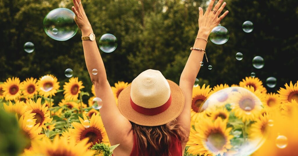 A joyful woman in a sunflower field with bubbles, expressing happiness on a summer day.